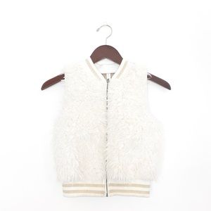 White fur vest